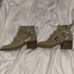 Tan faux suede buckle booties.